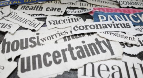 A pile of newspaper clippings with words associated with pandemic anxiety